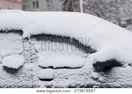 Side Windows Of A Car In The Snow Close Up