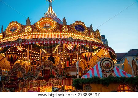 Dresden, Germany - 9.12.2018: Christmas Carousel At Night On Market Striezelmarkt In Dresden In Germ