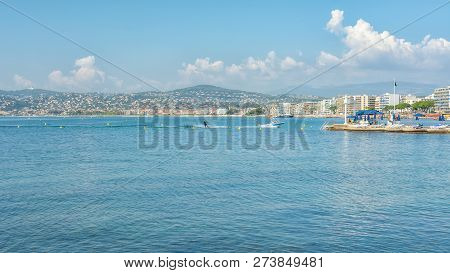 Juan-les-pins, France, September 19, 2018: Woman Water Skiing In The Golfe Juan With In The Backgrou
