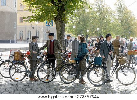 Stockholm - Sept 22, 2018: People Wearing Old Fashioned Tweed Clothes From The 1950s Leading Their R