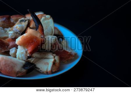 Crab Claws From Atlantic Coast On A Plate In The Black Background