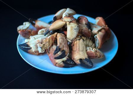 Crab Claws From Atlantic Coast On A Plate In The Black Background