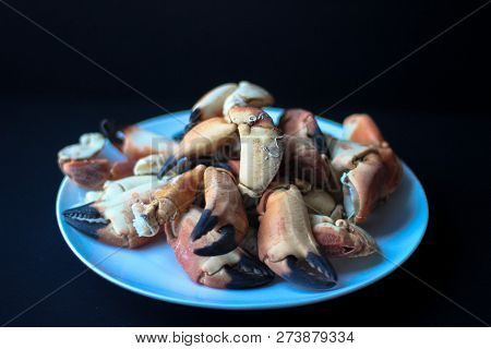 Crab Claws From Atlantic Coast On A Plate In The Black Background