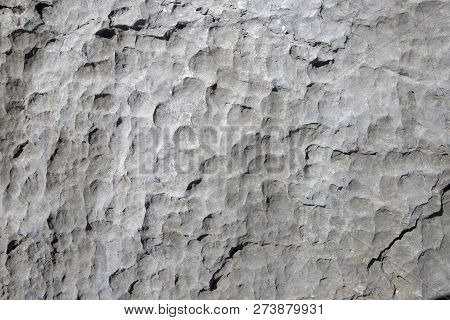 White Rock Rough Texture. Stone Surface Photo. Chipped Stone Surface With Cutter Marks. Aged Stone W
