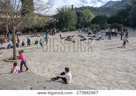 School Children Playing In The Yard By The Monastery