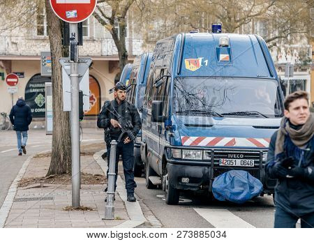 Strasbourg, France - Dec 11, 2018: Police Officer With Rifle Near Blue Van Surveilling Area After Th
