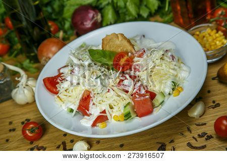 Healthy Vegetable Salad Of Chinese Cabbage, Corn, Cucumbers And Tomatoes. Delicious Vegetarian Dieta