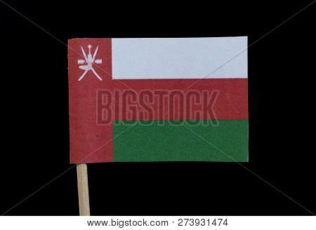A Unique And Different Flag Of Oman On Toothpick On Black Background. 	A Horizontal Tricolor Of Whit