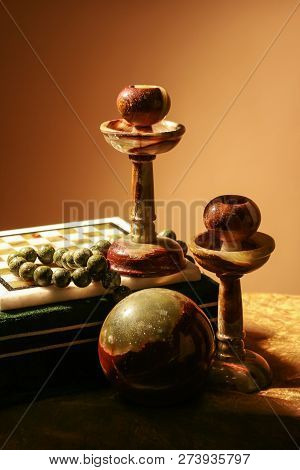 Still Life With Stone Candle Holders, Ball Of Agate, Jade Rosary And Chess Board
