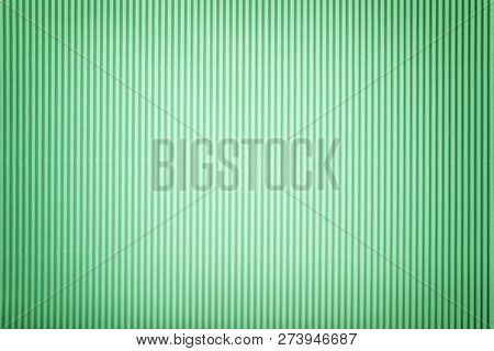 Texture Of Corrugated Light Green Paper With Vignette, Macro. Striped Pattern Of Cyan Cardboard Back