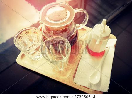 drip coffee barista on glass jar / make cup coffe and honey bee on tray wooden black table cafe shop