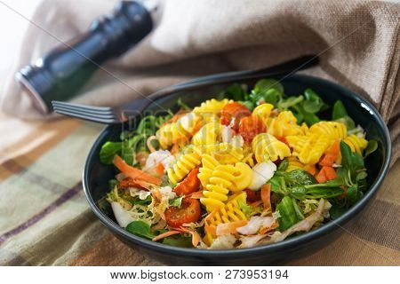 Salad made from radiatori cooked pasta, goat cheese and oil vinaigrette