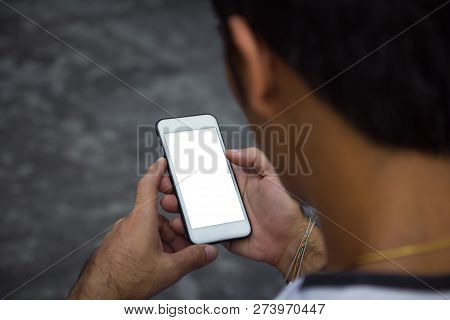 Man Holding, Touching Or Working On Mobile Phone With Blank White Screen With Copy Space. Male Hands