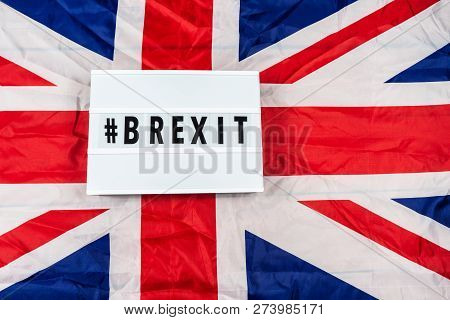 Brexit Concept Union Jack And Eu Flag Separated.piggy Coin Bank On Side,1p And 2p Coins.