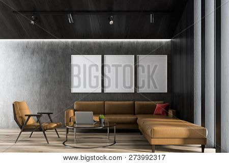 Interior Of Modern Living Room With Concrete And Dark Wooden Walls, Wooden Floor, Beige Leather Sofa