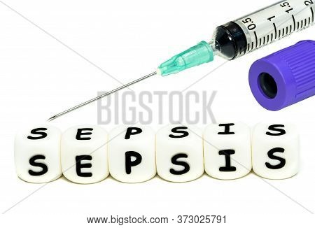 A Laboratory Test Tube And A Syringe For Blood Sampling.