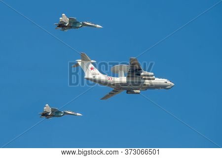 Saint Petersburg, Russia - July 25, 2019: A-50 Liska Aircraft (rf-93966), Accompanied By Two Su-30sm