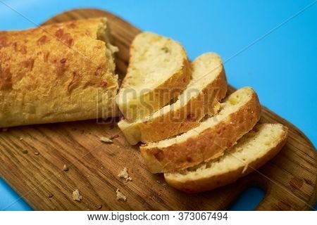 Sliced Ciabatta On A Blue Background.