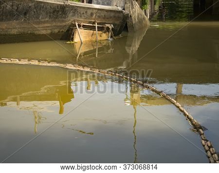 buoy entrap garbage  in canal , prevent  wastrel float to the sea