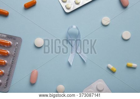 Blue Symbolic Ribbon, The Problem Of Colon Cancer, Prostate Cancer Ribbon, Blue Background With Pill
