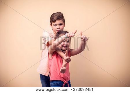 A Portrait Of Happy Children Boy And Girl. Childhood And Frendship Concept