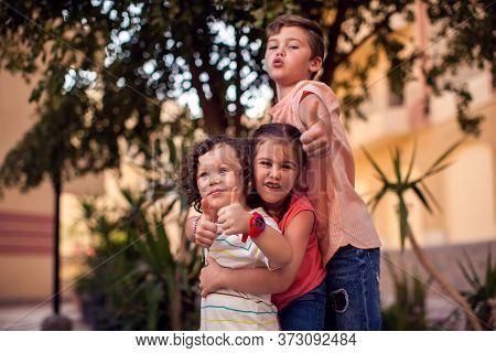 Children Outdoor. Childhood, Family And Frendship Concept