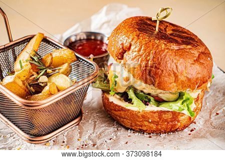 burger with tomato sauce and baked potato