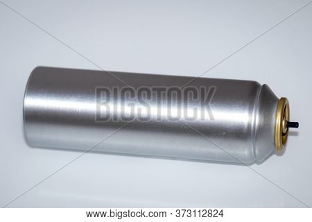Inclusion Of A Metal Spray Can As Used For Hairspray Or Deodorant