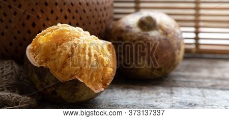 Exotic Indian Bel Fruit Or Wooden Apple. Bel Fruit Slices On Wooden Rustic Background. Natural Detox