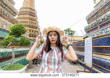 Beautiful Asian Tourist Backpack Women Walking Travel In Buddhistm Temple Pagoda Statue