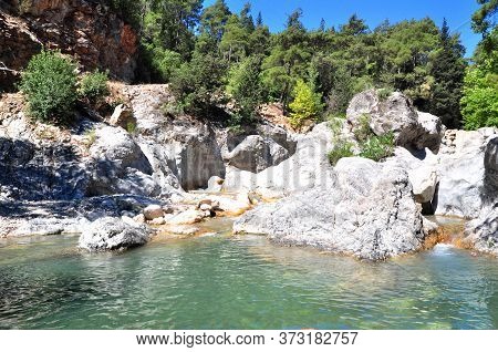 A Small Mountain Lake Among The Stones