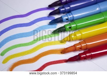 A Bunch Of Colored Markers Laid Out In Rainbow Order. Stationery Concept. Copy Space. Isolated