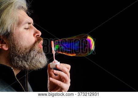 Bearded Man Blowing Soap Bubbles. Handsome Man Blowing Bubbles. Soap Bubbles. Play With Bubbles. Hap