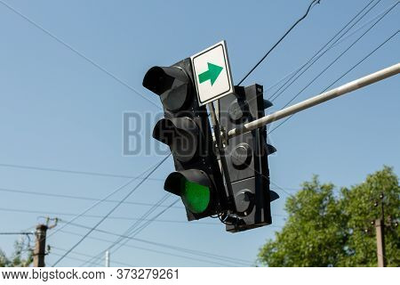 A Traffic Light With A Green Light