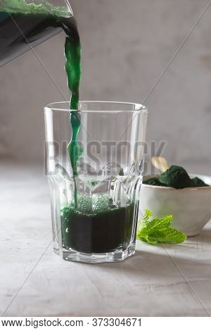 Green Drink Prepared With Single Celled Green Algae Chlorella. Detox Superfood In The Glass