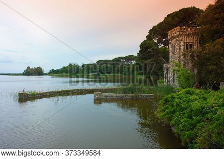The Turret Of Villa Orlando On The Lake Massaciuccoli With Water E Vegetation