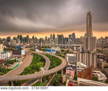Bangkok, Thailand urban cityscape and office towers at dusk.