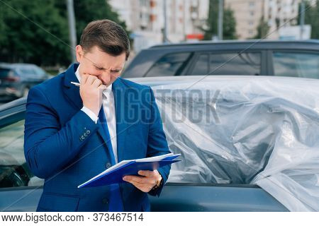 A Man Writes In A Tablet Next To The Car. An Accident On The Road, The Airbag Didnt Work.
