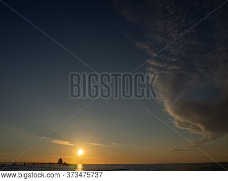 sundown at the beach of zingst at the baltic sea