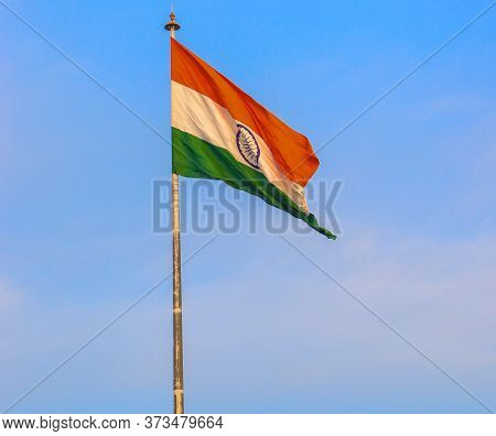 India Flag With Clear Blue Sky In The Background