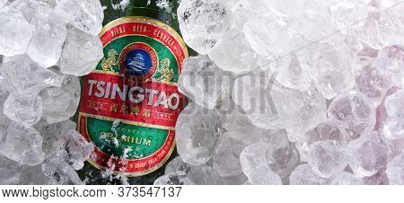 Two Bottles Of Tsingtao Beer In Crushed Ice