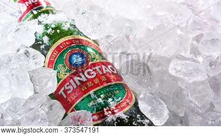 Two Bottles Of Tsingtao Beer In Crushed Ice