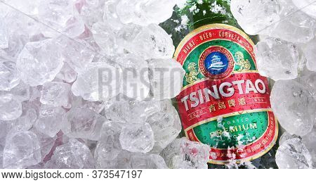 Two Bottles Of Tsingtao Beer In Crushed Ice