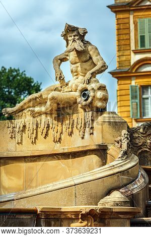 Seehof Palace, Aquarius Sculpture Against The Backdrop Of The Castle, Blurred Background. Bavaria, G
