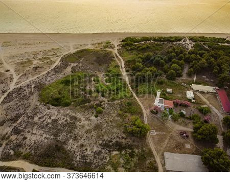 Lighthouse Landscape Coastal Drone Shot In Greece. Evening Aerial Top View Of Phare Beacon At Possid