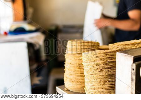Tortillas Stacked On A Tortilla Machine