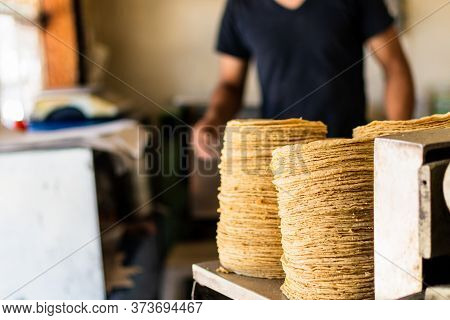 Tortillas Stacked On A Tortilla Machine