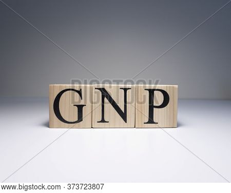 Gnp , Gross National Product, Sign On Wooden Cubes. Clse Up.