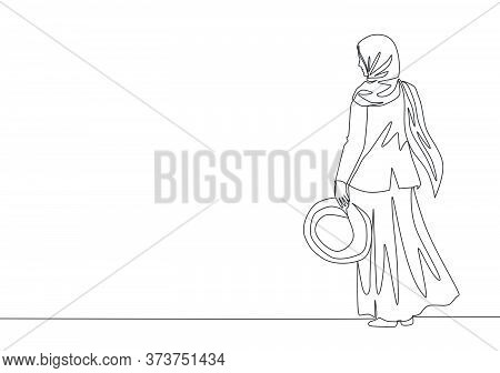 One Continuous Line Drawing Of Young Happy Pretty Muslimah On Headscarf Holding Hat On Her Hand. Bea