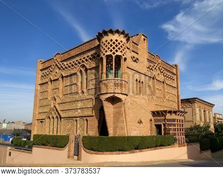 Colonia Guell/spain - 11.24.2017: One Of The Old Red Brick Mansions In The Guell Colony On A Clear S